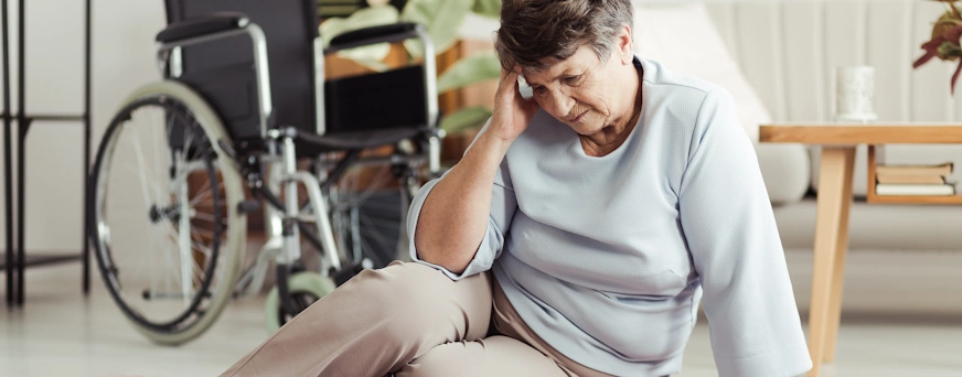 Life Assure Senior Woman Needing Wheelchair On Floor After Falling Hero